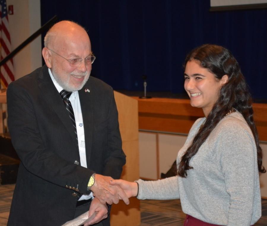 WINNER: Milken High School senior Gabi Kamran receives the first-ever Norman Alexander Award from Mel Wacks, director of the Jewish-American Hall of Fame. Gabi wrote about Betty Friedan and tikkun olam.