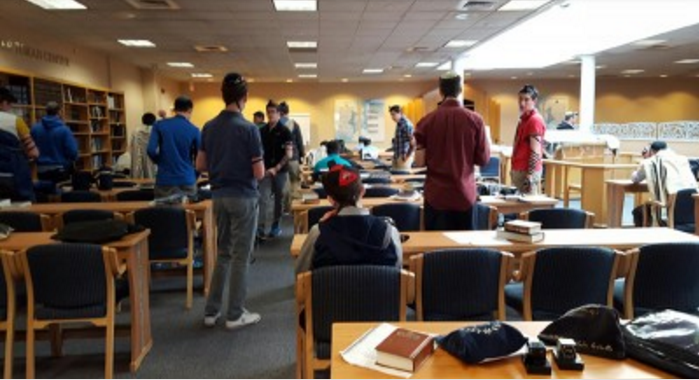 SIMILIARITIES: Students at the Rae Kuskner Yeshiva High School in New Jersey all pray together in one minyan. 