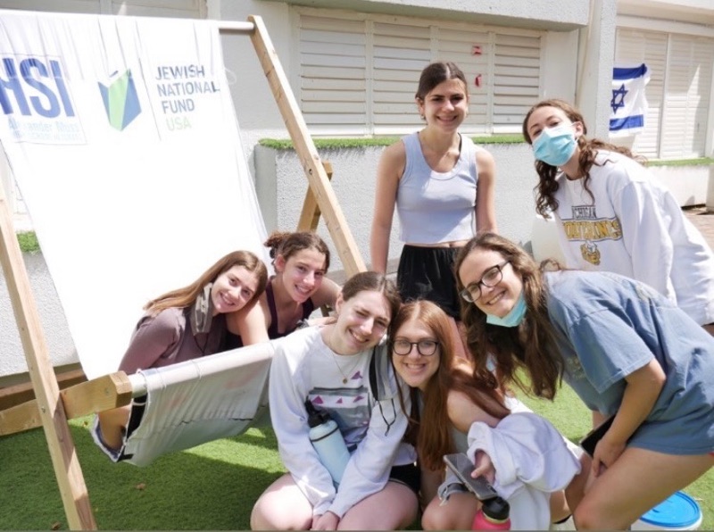 Seniors in the same pod gather outside at the AMHSI campus. The seniors are currently on their seventh of quarantining.