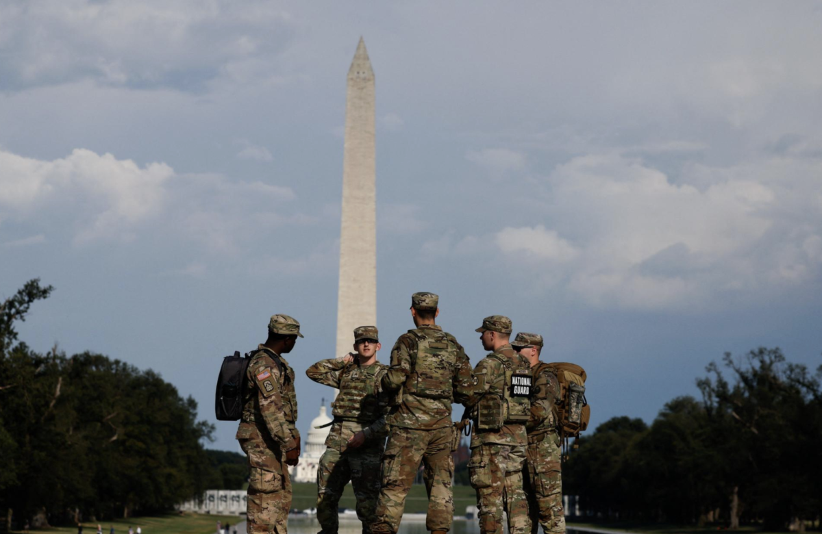 Members of the U.S. National Guard keep watch at the National Mall, with the Washington Monument in the background, weeks after U.S. President Donald Trump ordered an increased presence of federal law enforcement to assist in crime prevention, in Washington, D.C., Sept. 4, 2025.