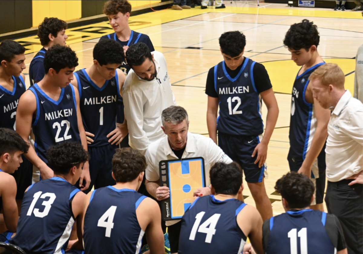 Milken’s Varsity Basketball Team during a timeout at YULA. 